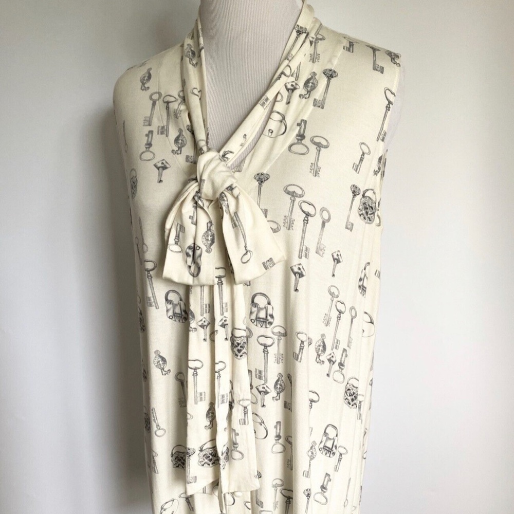 CABI KEYS PLEASE 171 SLEEVELESS
TIE NECK TUNIC BLOUSE IVORY
